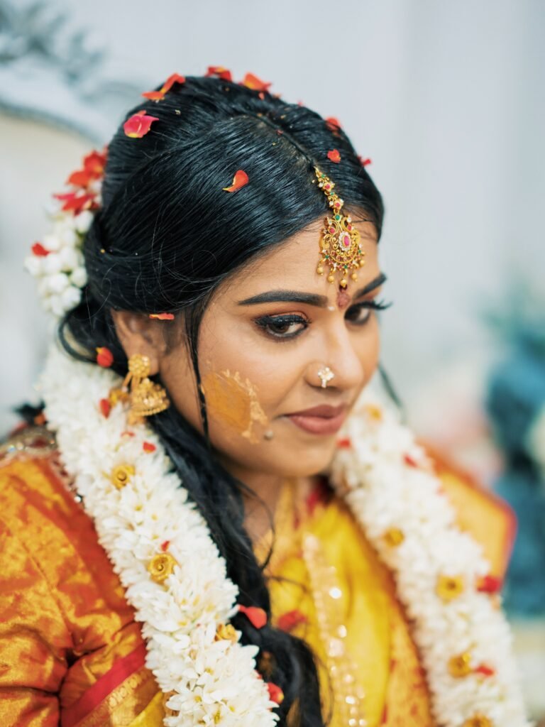 Close-up of a South Asian bride during her traditional Indian Haldi ceremony.